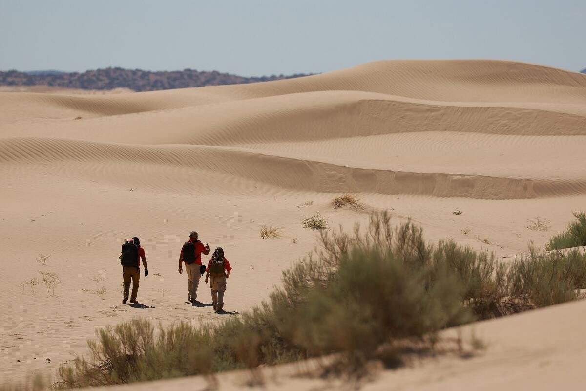 Authorities search for migrants lost in the Samalayuca desert, outside Mexico.