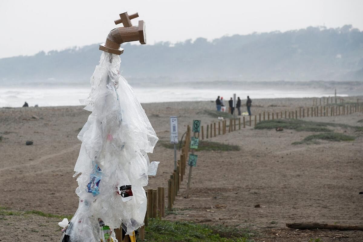 An installation of a water tap leaking plastics to raise awareness about plastic pollution is pictured in Concon, Chile.