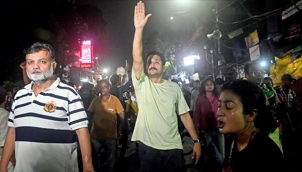 Director Srijit Mukherjee, actor Parambrata Chatterjee and others during a protest rally against the recent alleged rape and murder of a woman doctor at RG Kar Medical College and Hospital, in Kolkata, Sunday, Aug. 18, 2024.