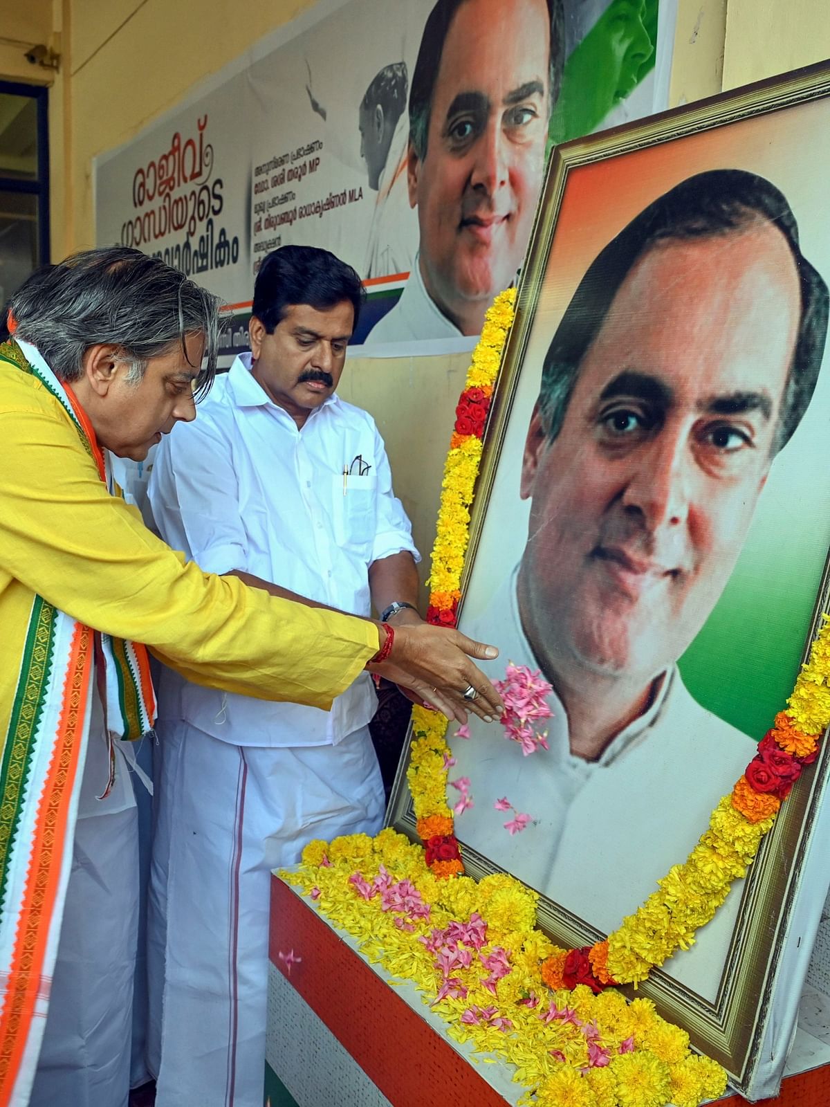 Congress MP Shashi Tharoor pays floral tribute to former prime minister Rajiv Gandhi on his birth anniversary, in Thiruvananthapuram.