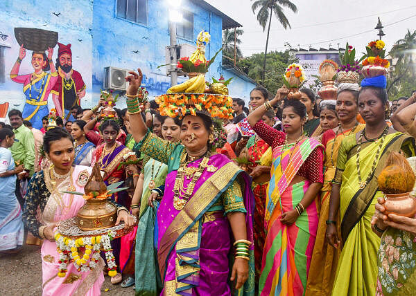 Women from the Koli fishing community perform rituals as they celebrate 'Narali Purnima' festival, in Mumbai.