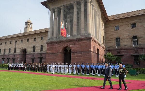  Japan's Defence Minister Minoru Kihara after inspecting the Tri-Services guard of honour at the South Block, in New Delhi.