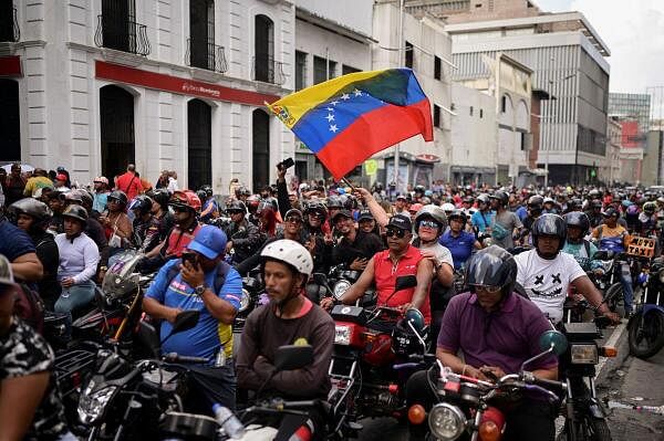 Motorized supporters of Venezuelan President Nicolas Maduro rally in favor of a proposed bill against “Fascism” and “Neo Fascism” which would allow the government to ban political parties, organizations or media found to incite fascism, in Caracas, Venezuela.