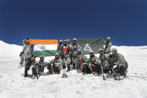  Mountaineering team 'Kamyab Parvaz' of the Indian Army poses with the national flag after climbing Mount Arganglas Kangri (22220 ft), in Karakoram Range, Nubra Valley.