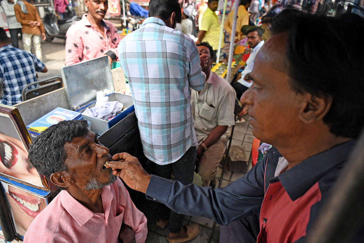 A doctor works at his advanced dental care clinic; Street