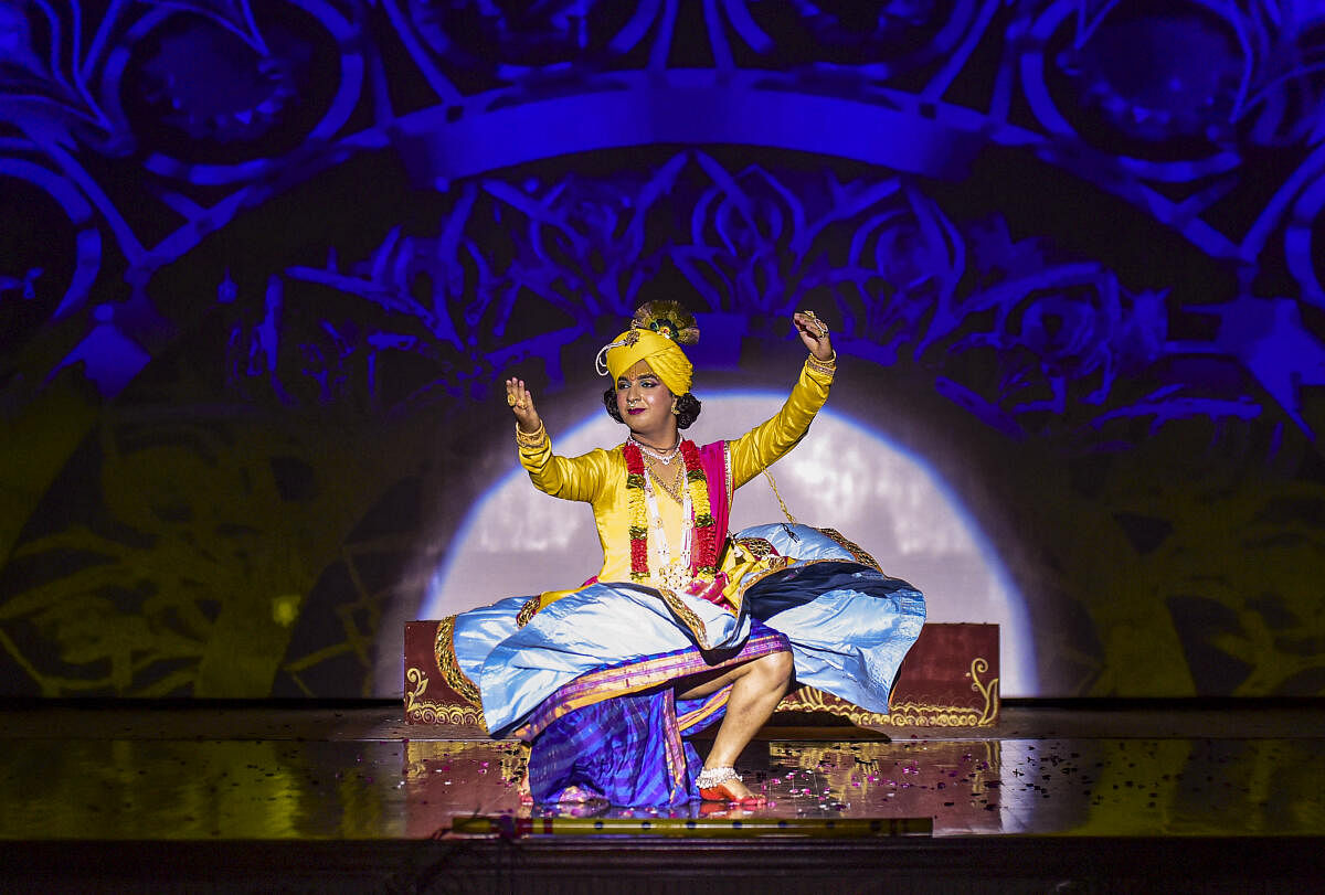 A student of Apeejay College of Fine Arts dressed as Hindu deity Krishna performs during a programme ahead of 'Janmashtami' festival, in Jalandhar.