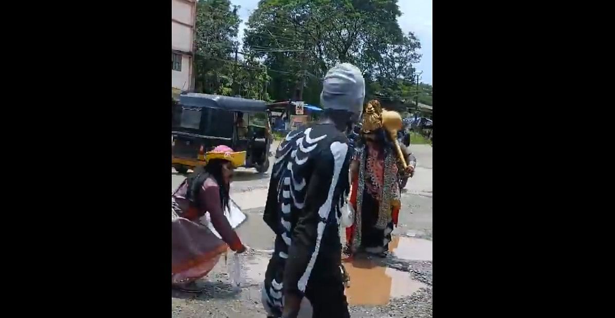 Social activists came up with creative skit to highlight pothole-ridden roads in Udupi.