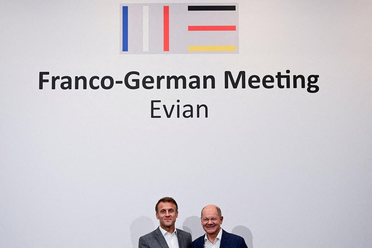 France's President Emmanuel Macron and Germany's Chancellor Olaf Scholz react as they meet during the 33rd Evian Annual Meeting to promote economic co-operation at Evian in the French Alps, France, September 6, 2024.