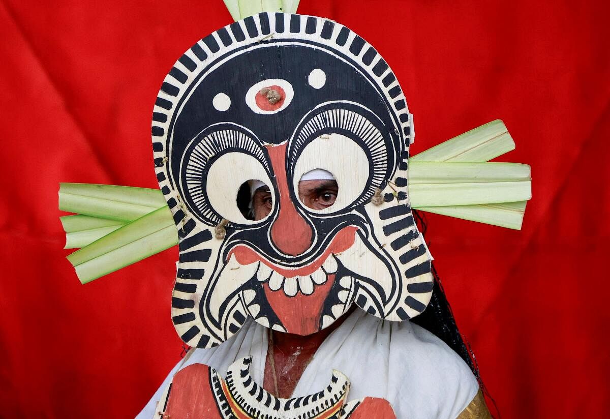 A dancer in traditional attire waits to take part in a performance during the festivities marking the start of the annual harvest festival of "Onam", in Kochi, India, September 6, 2024.