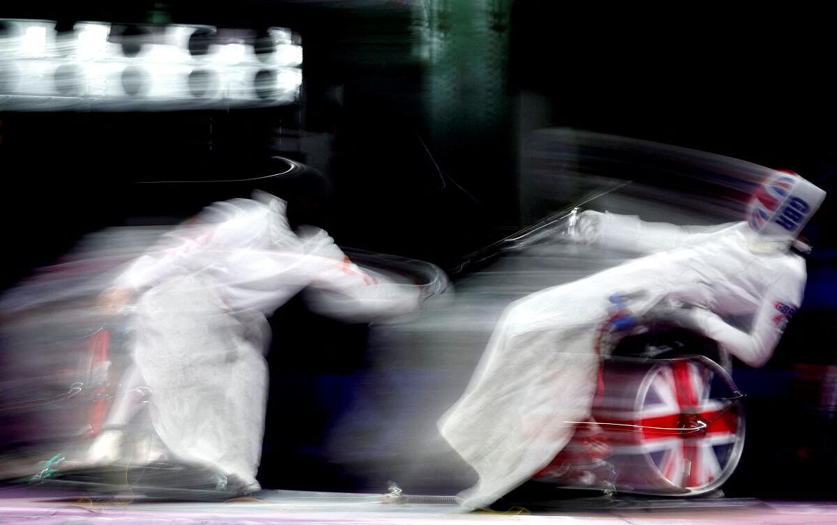 Paris 2024 Paralympics - Wheelchair Fencing - Men's Epee Category A Gold Medal Bout - Grand Palais, Paris, France - September 6, 2024 Gang Sun of China in action with Piers Gilliver of Britain