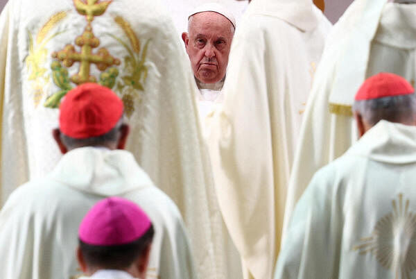 Pope Francis looks on as he presides a Mass with devotees at the National Stadium in Singapore