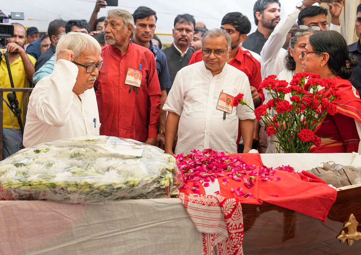 Veteran CPI(M) leader Biman Bose pays tribute to the mortal remains of party leader Sitaram Yechury, at the party headquarters, in New Delhi.