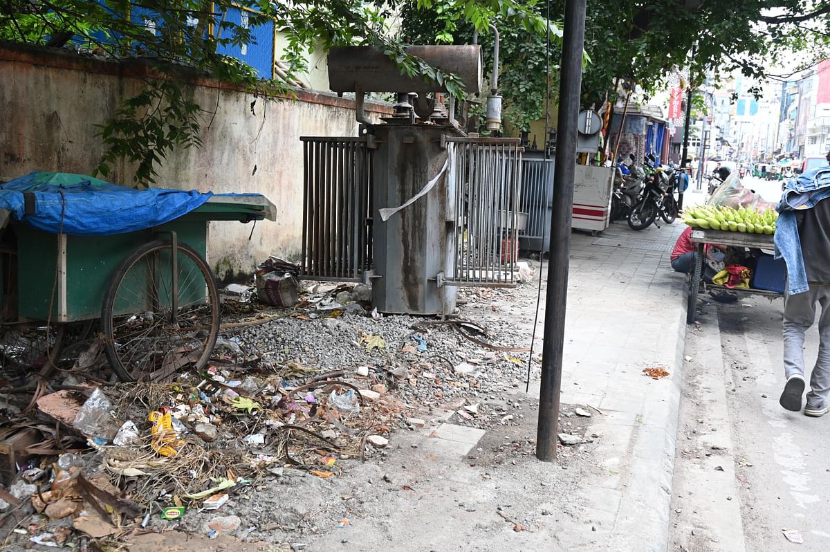 For DH point blank story of Bad footpath and encroachment on Dispensary road in Bengaluru on Wednesday. 