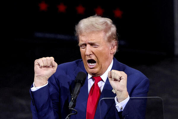 Republican presidential nominee and former U.S. President Donald Trump gestures while speaking during a campaign rally in Tucson, Arizona, U.S. September 12, 2024.