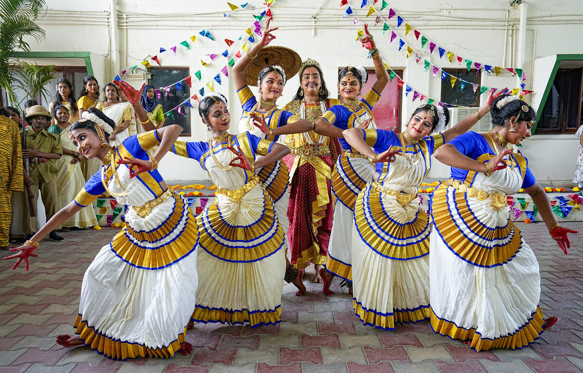 College students perform as part of the Onam festival celebrations at their college premises, in Chennai.