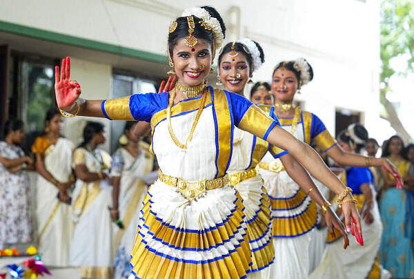 College students perform as part of the Onam festival celebrations at their college premises, in Chennai.