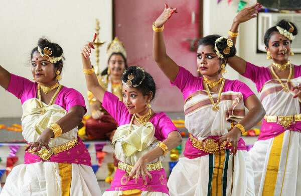 College students perform as part of the Onam festival celebrations at their college premises, in Chennai.