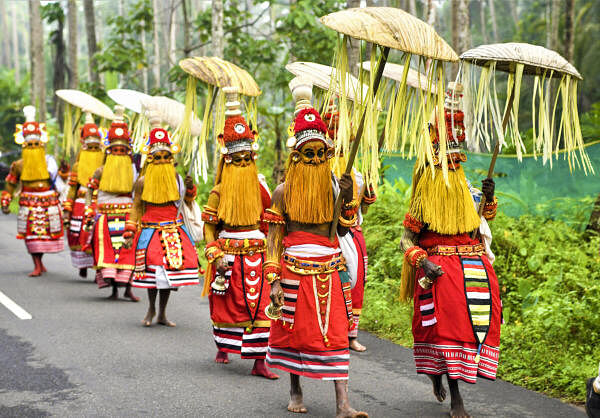 Local folk artists perform during the Onam celebrations in Kozhikode.