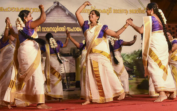 Artists perform 'thiruvatira' dance as part of the Onam celebration, at Thrikkakara Mahadeva Temple in Kochi.