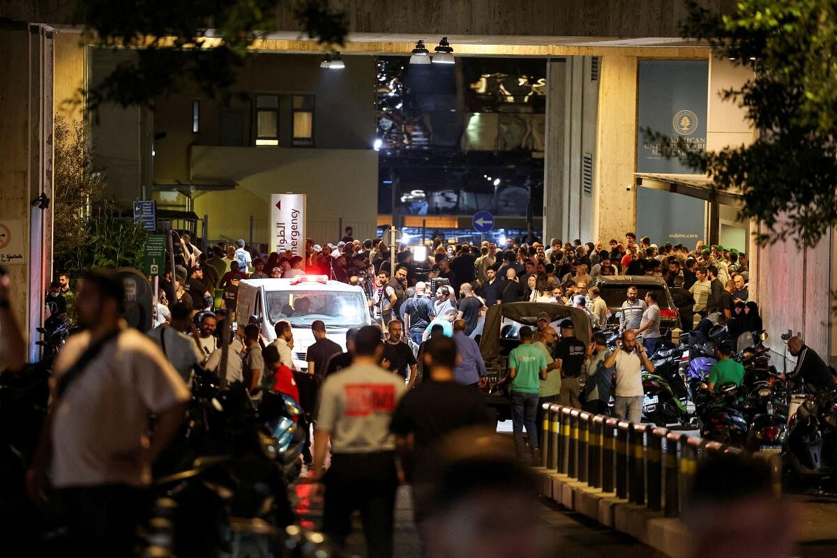 People gather outside American University of Beirut Medical Center (AUBMC) as more than 1,000 people, including Hezbollah fighters and medics, were wounded when the pagers they use to communicate exploded across Lebanon, according to a security source, in Beirut, Lebanon September 17, 2024.