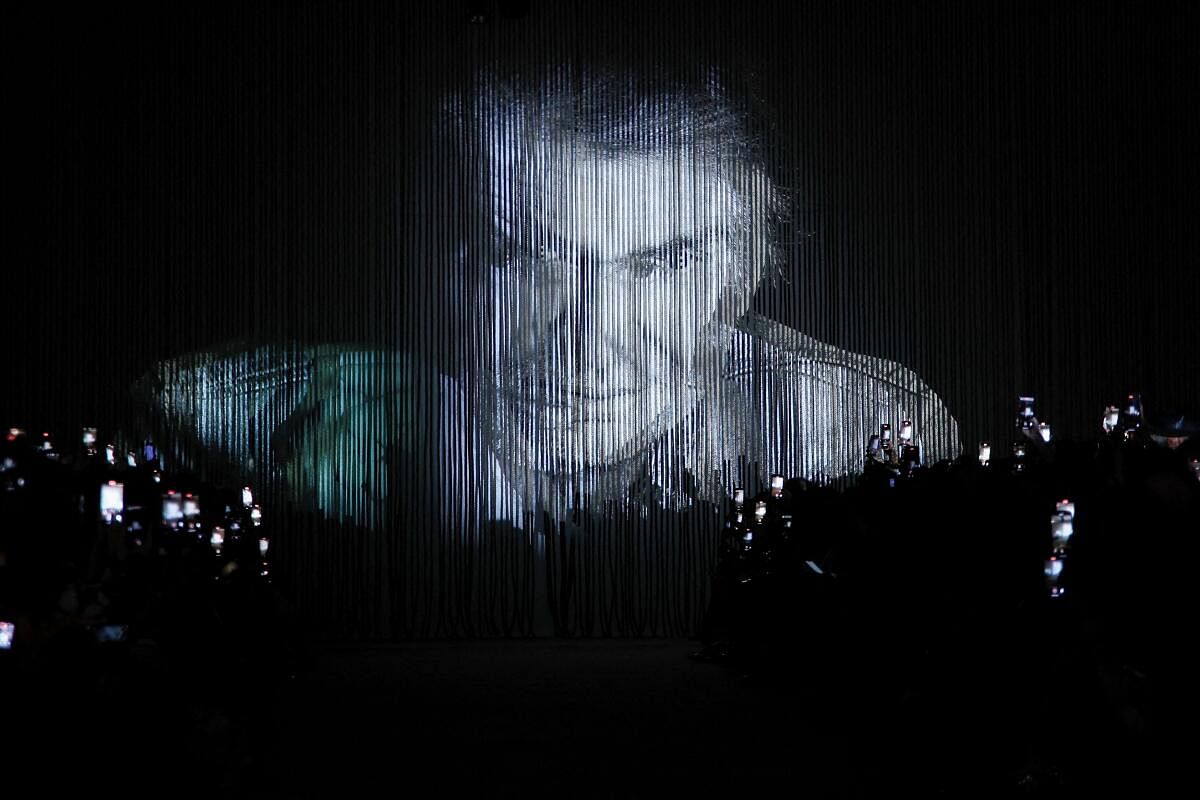 An image of Roberto Cavalli is projected during the presentation of the Spring/Summer 2025 collection during Fashion Week in Milan, in Italy, September 18, 2024.