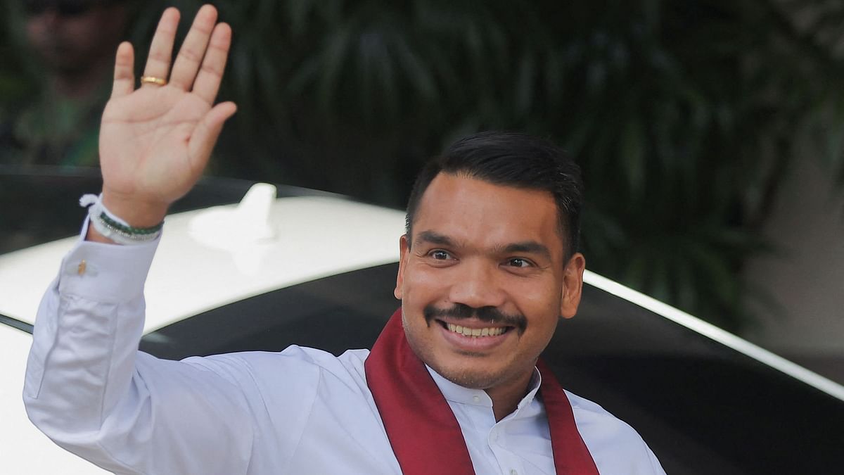 Namal Rajapaksa of the Sri Lanka Podujana Peramuna  party, gestures as he arrives at the Election Commission in Rajagiriya to submit his nomination papers for the upcoming presidential election, scheduled for September 21, in Colombo, Sri Lanka August 15, 2024.