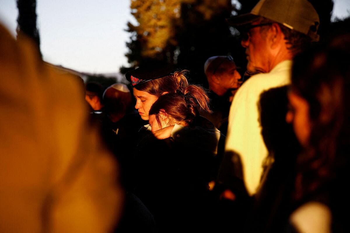 People mourn Israeli military paramedic First Sergent Agam Naim, who was killed amid the ongoing conflict in Gaza between Israel and Hamas, during her funeral in Kibbutz Mishmarot, in northern Israel, September 18, 2024.