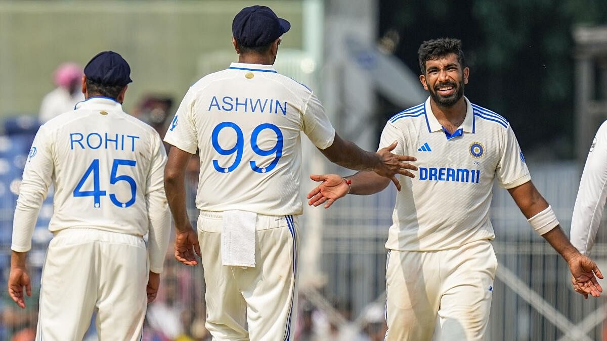 Jasprit Bumrah celebrates with team-mates after dismissing Taskin Ahmed on the second day of the first cricket Test in Chennai.