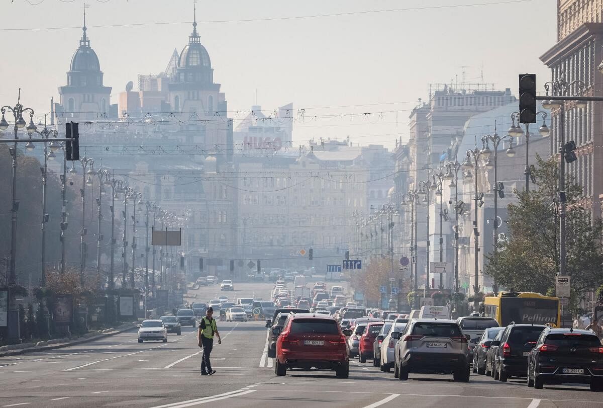 A policeman regulates traffic as the city is shrouded in smog in Kyiv, Ukraine September 20, 2024.