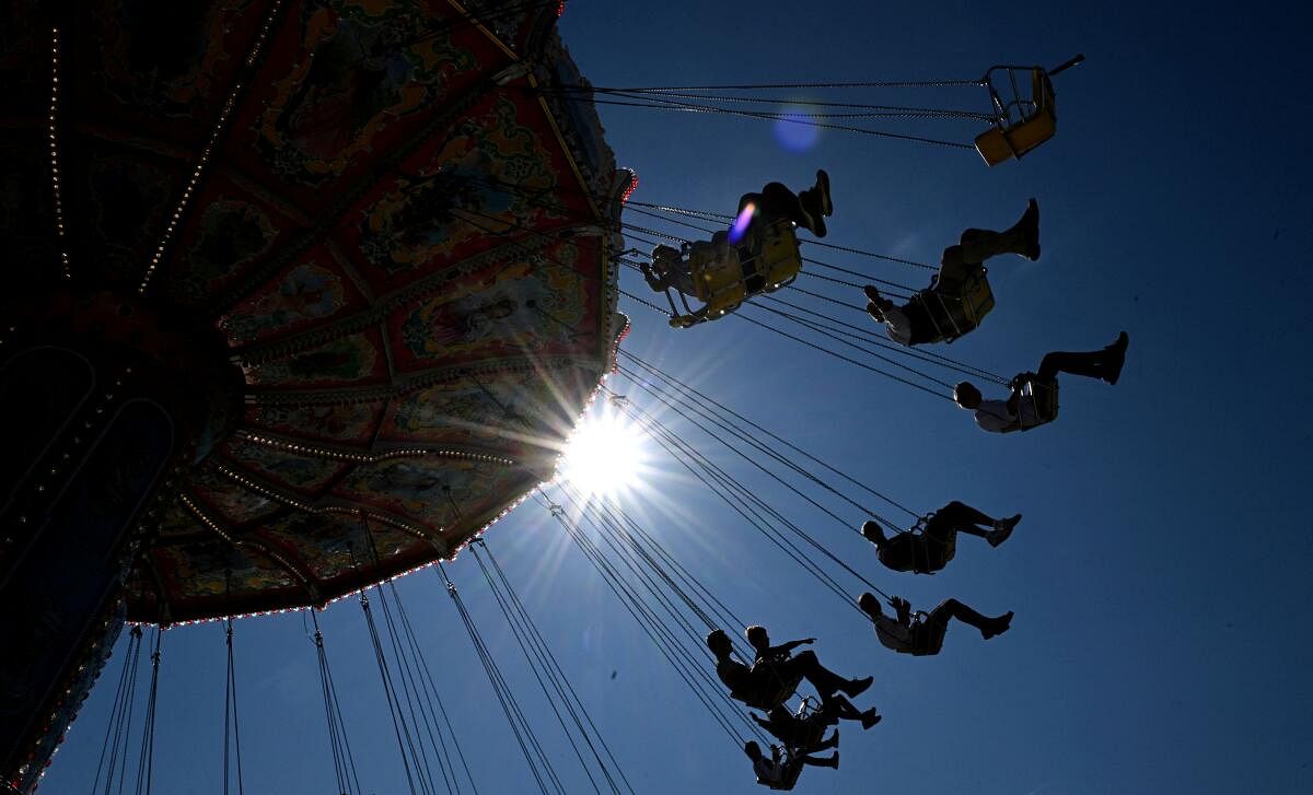 Guests ride a chain carousel on the day of the official opening of the 189th Oktoberfest, the world's largest beer festival in Munich, Germany, September 21, 2024.