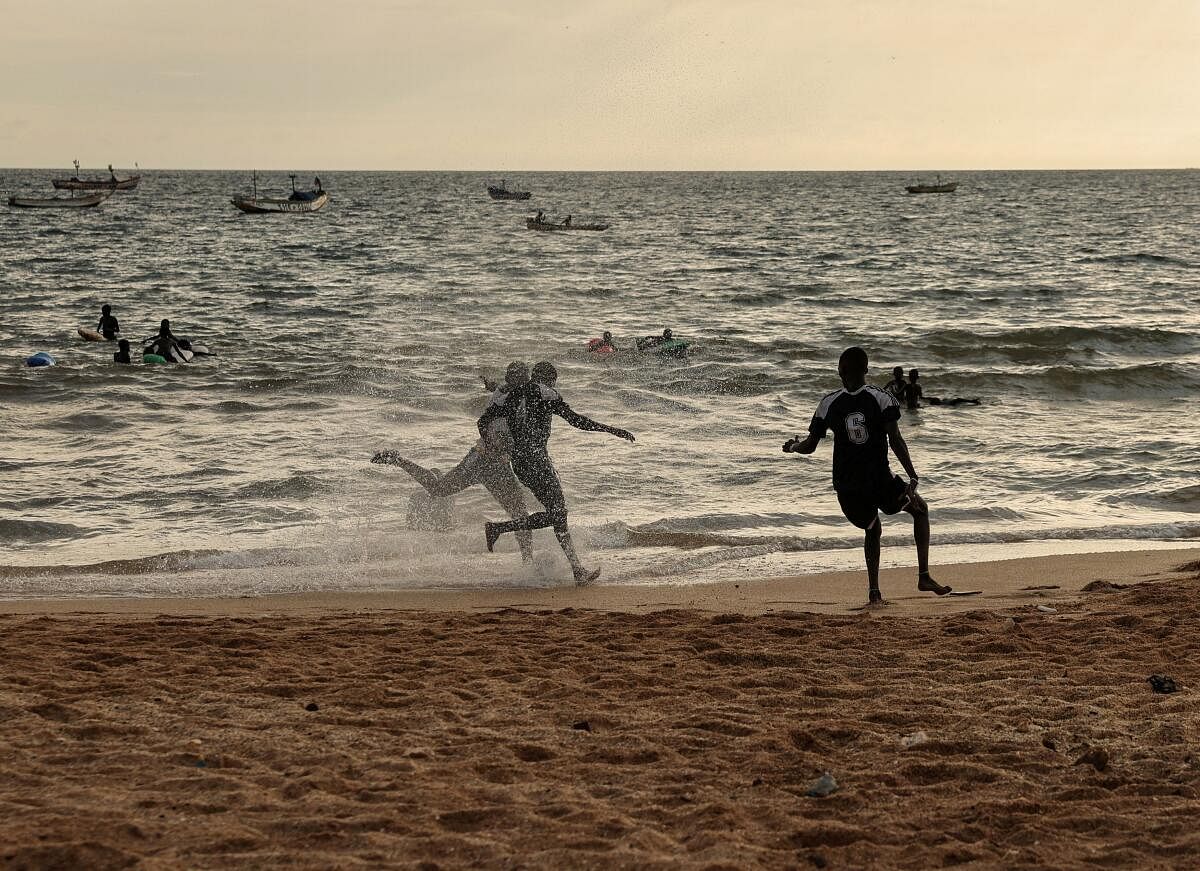 People play soccer on the beach in Toubab Dialaw on the outskirts of Dakar, Senegal.