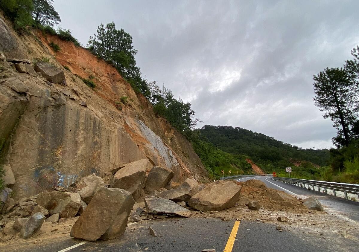 A general view shows large rocks, debris and mud left after a landslide on the highway on the way from Puerto Escondido to Oaxaca, in the aftermath of Hurricane John, Oaxaca state, Mexico