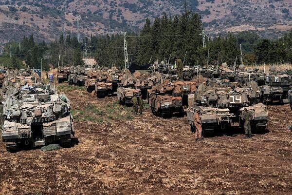 Israeli armoured military vehicles in formation, amid cross-border hostilities betweenÊHezbollahÊand Israel, in northern Israel, September 27, 2024.