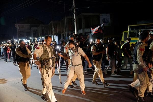 Indian security personnel work during a protest by Kashmiri Shia Muslims against Israel following the killing of Hezbollah leader Sayyed Hassan Nasrallah in an Israeli airstrike in Beirut, in Srinagar September 28, 2024