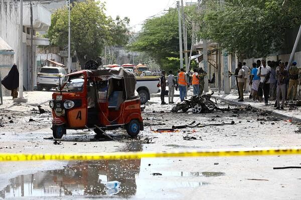 Somali security officers cordon off the area of the wreckage of a rickshaw at the scene of an explosion on a bomb-rigged car that was parked on a road near the National Theatre in Hamarweyne district of Mogadishu, Somalia September 28, 2024.