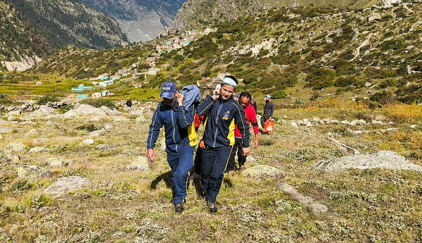 SDRF personnel during an operation to rescue trekkers stranded on Dronagiri trek, in Chamoli district, Saturday, Sept. 28, 2024. 