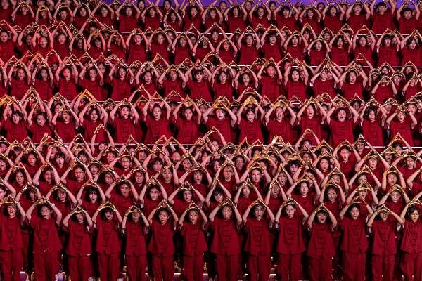 Around 1,000 students sing patriotic songs at an event to celebrate the 75th anniversary of China's National Day in Hong Kong, China.