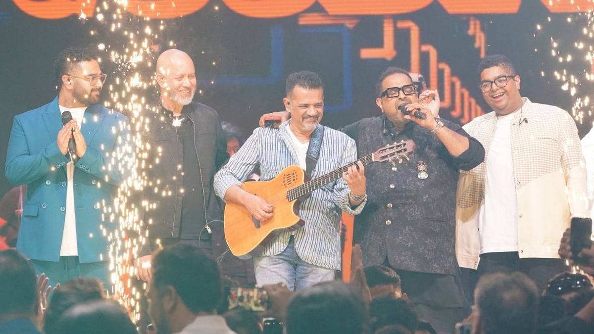 Indian musical trio consisting of Shankar Mahadevan, Ehsaan Noorani and Loy Mendonsa perform on the stage.