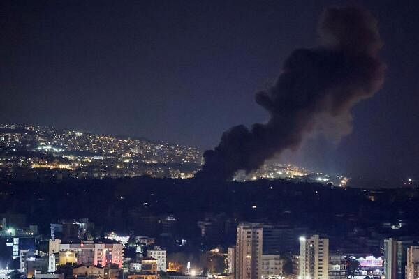 Smoke rises over Beirut's southern suburbs after a strike, amid ongoing hostilities between Hezbollah and Israeli forces, as seen from Sin El Fil, Lebanon. 