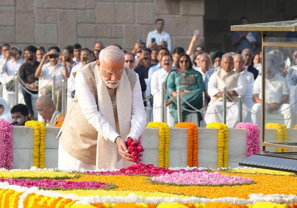 Prime Minister Narendra Modi pays homage to Mahatma Gandhi on his birth anniversary, at Rajghat in New Delhi.