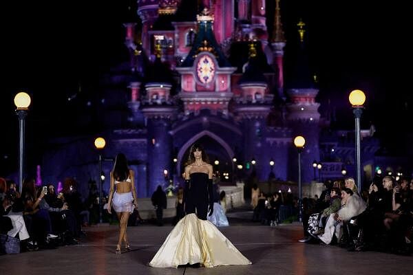 A model presents a creation by designers Sebastien Meyer and Arnaud Vaillant as part of their Spring/Summer 2025 Women's ready-to-wear collection show for fashion brand Coperni during Paris Fashion Week at the theme park Disneyland Paris in Marne-la-Vallee, near Paris, France.