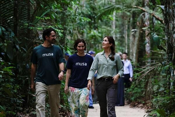 Denmark's Queen Mary walks near archaeologist Meliam Gaspar and MUSA Director Felippo Stampanoni on a trail in the middle of the Amazon rainforest in Manaus, Brazil.