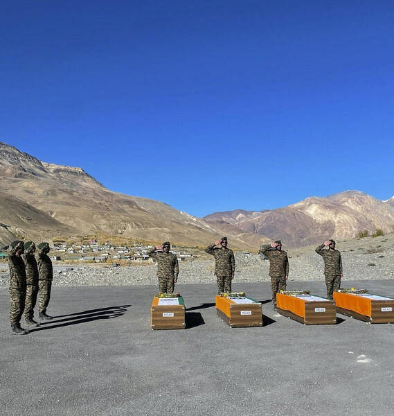 Military personnel pay tribute to the mortal remains of personnel from the Indian Air Force (IAF) AN-12 aircraft which crashed on Rohtang Pass in 1968 and were recovered during a recent expedition, before they are taken to their hometown.