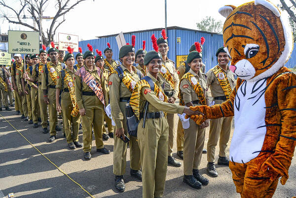 Social activists, NCC volunteers, students and forest officials during an awareness rally to save tigers, organised under Wildlife Week celebration, in Bhopal.