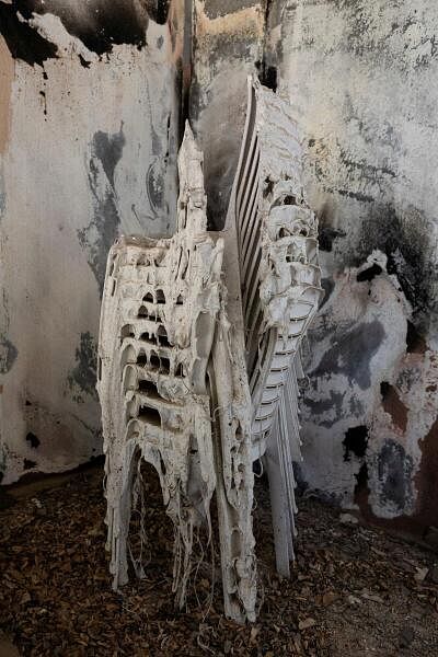 A stack of melted chairs sits, nearly a year since the deadly October 7 attack by Hamas, in Kibbutz Nir Oz, southern Israel, September 30, 2024.