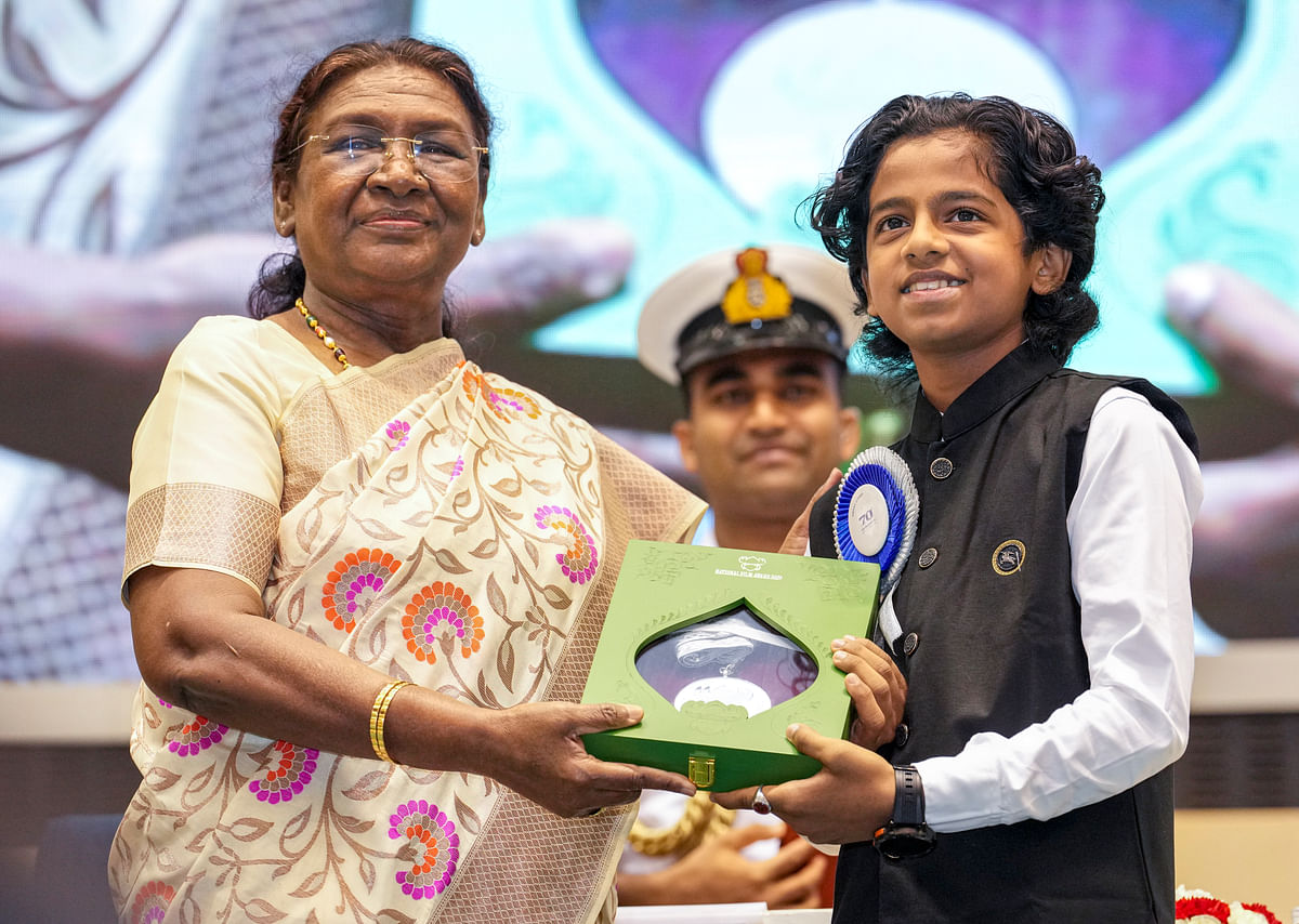 President Droupadi Murmu presents the 'Best Child Artist’ award for Malikappuram to Sreepath P K during the 70th National Film Awards, at Vigyan Bhawan, in New Delhi.