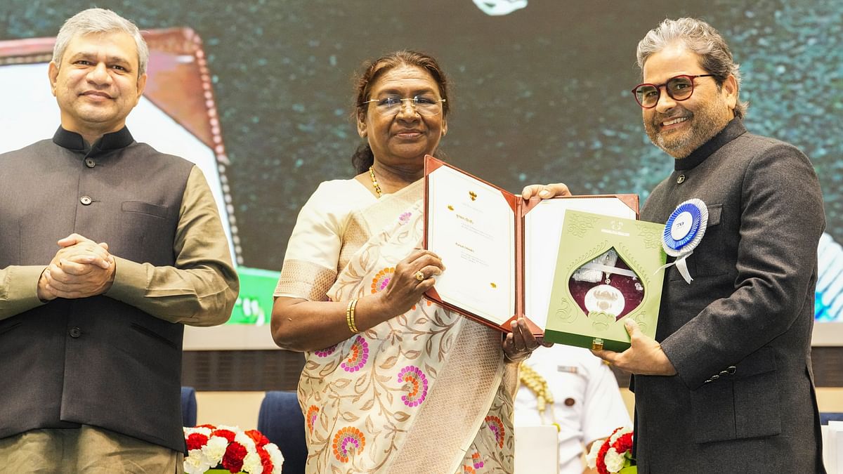 President Droupadi Murmu presents an award to music composer and filmmaker Vishal Bhardwaj during the 70th National Film Awards, at Vigyan Bhawan, in New Delhi.