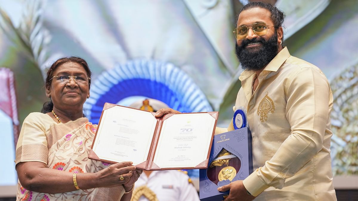 President Droupadi Murmu presents the ‘Award for Best Popular Film Providing Wholesome Entertainment’ for Kantara  to actor and director Rishab Shetty during the 70th National Film Awards, at Vigyan Bhawan, in New Delhi