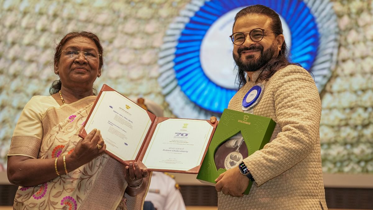 President Droupadi Murmu presents the Best Music Direction (Songs) award for Brahmastra Part 1: Shiva to Pritam Chakraborty during the 70th National Film Awards, at Vigyan Bhawan, in New Delhi.