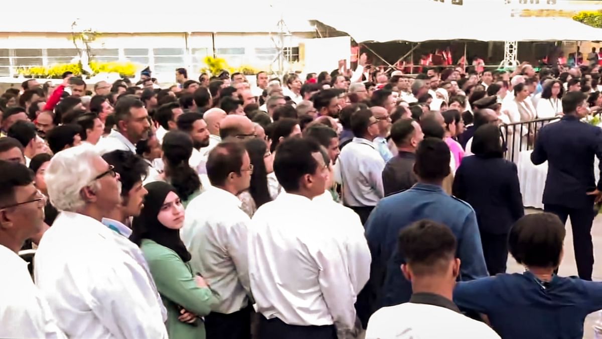 People gather to pay their last respects to the mortal remains of former Tata Group Chairman Ratan Tata at the NCPA lawns, in Mumbai.